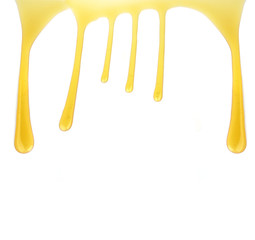 flow of sweet honey on the white background