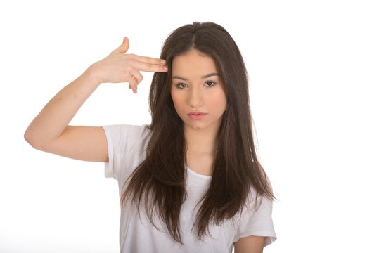 Young woman showing suicide sign.