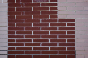 brick wall of different colors with geometric shapes
