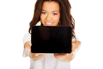 Woman showing tablet computer.