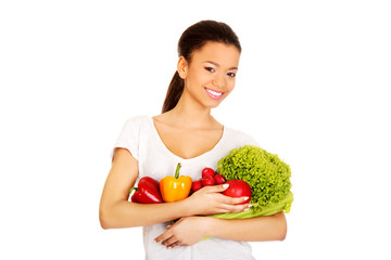 Young woman with vegetables.