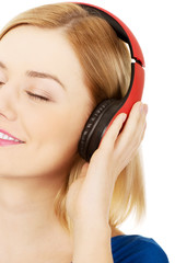 Fototapeta premium Woman with headphones listening to music. 