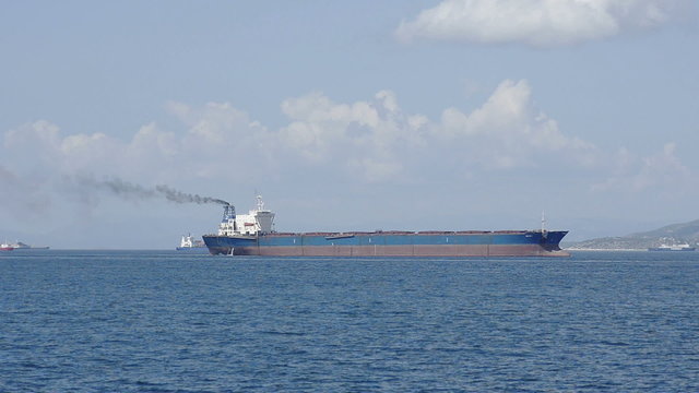 Large cargo tanker on the background ships