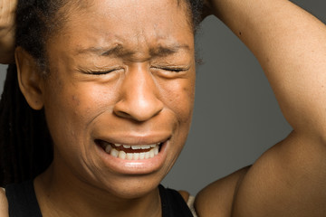 Fototapeta premium Stressed model pulling hairs