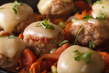 Meatballs baked with mozzarella closeup. horizontal