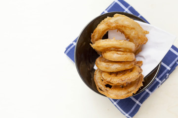 Closeup golden onion ring with space on background center