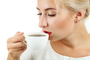 Young beautiful girl drinking coffee