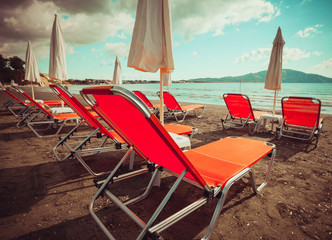 Fototapeta na wymiar sunchairs with umbrellas on beautiful beach
