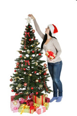 Young beautiful woman with christmas tree on white background