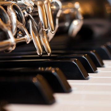  Fragment of a clarinet lying on piano keys