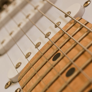 Fragment of the electric guitar closeup 