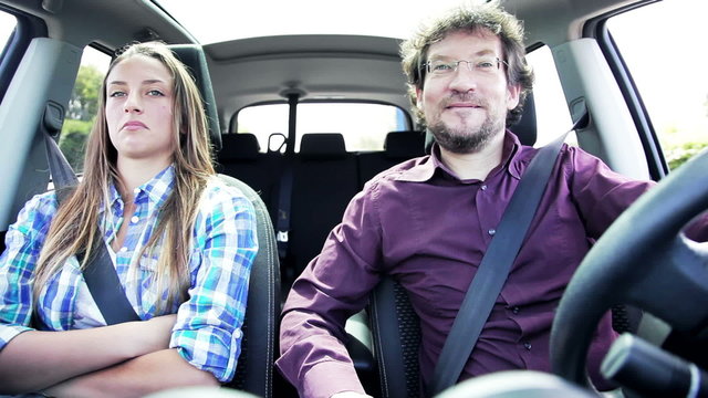 Father and daughter talking in car making him mad