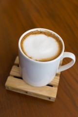 capucino coffee on wood background