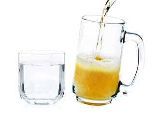 pouring beer into the glass and drinking water on a white backgr