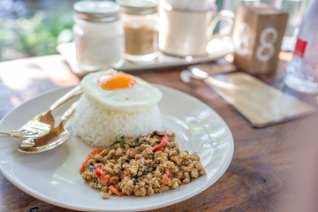 Stir pork with basil topped rice ,Thai food