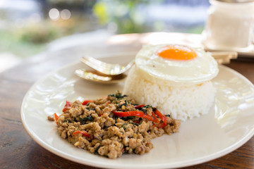 Stir pork with basil topped rice ,Thai food