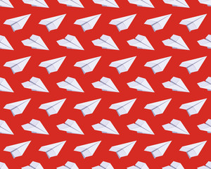 Fototapeta na wymiar Seamless pattern with isometric paper planes against the red