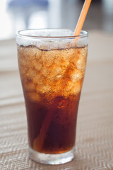 A glass of cola with ice