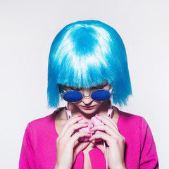 girl with blue hair listening music