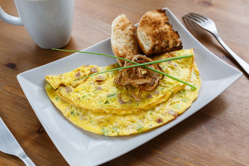 Denver omelet with toasts and fried onion