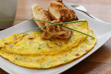 Omelet with ham, cheese and onion