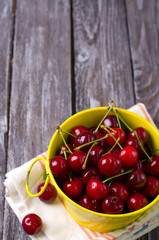 fresh cherries on wooden table