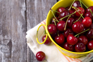 fresh cherries on wooden table