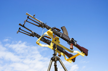 machine gun on a stand against the sky