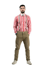 Naklejka premium Bearded young dj in retro clothes with headphones around neck