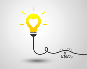 Shining light bulb with heart as idea and motivation concept