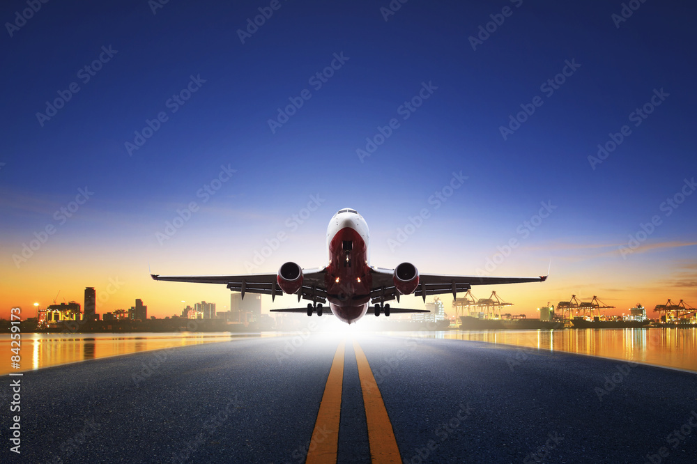 Canvas Prints cargo plane take off from airport runways against ship port back