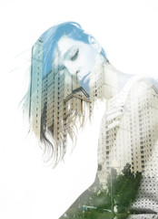 Double exposure of beautiful girl and modern buildings

