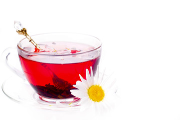 Cup of tea with teabag over white