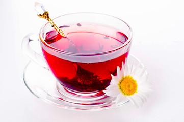 Cup of tea with teabag over white
