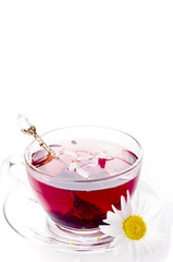 Cup of tea with teabag over white