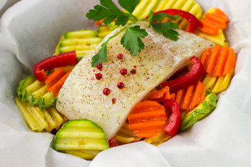 Cooking fish with vegetables in parchment. Healthy eating, diet
