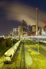 Power Station And Train At Night