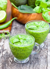 green healthy vitamin cocktail in the glass cup