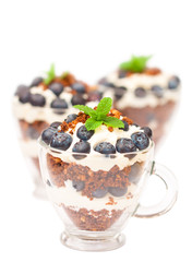 homemade desert with cream chopped cookies and fresh blueberry o