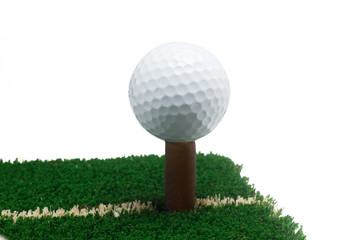 Golf ball on green grass, selective focus