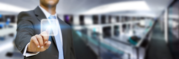 Businessman in his office using tactile interface