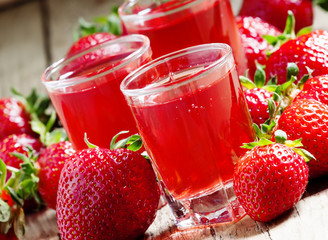 Clear fresh cold strawberry juice, selective focus