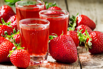 Clear fresh cold strawberry juice, selective focus