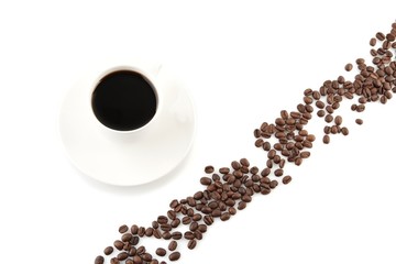 Coffee beans arranged diagonally with coffee cup on white - Powered by Adobe