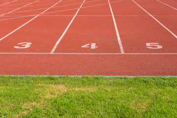 Start track lanes 3 4 5  of a red racing track