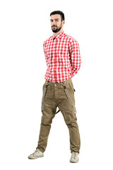 Naklejka premium Relaxed hipster posing with hands on back