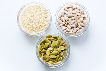 Pumpkin, sunflower, and sesame seeds in the glass bowls