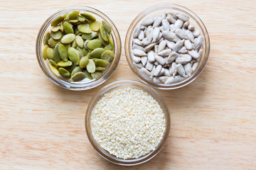 Pumpkin, sunflower, and sesame seeds in the glass bowls