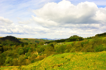 Fototapeta na wymiar Small settlement in rural area in Highlands of Scotland, UK. Bea