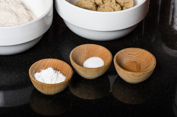 Wooden bowls with spices and ingredients